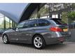 BMW 3-serie Touring 318D HIGH EXECUTIVE XENON | NAVIGATIE | SPORTSTOELEN | SPORT PAKKET | CAMERA |